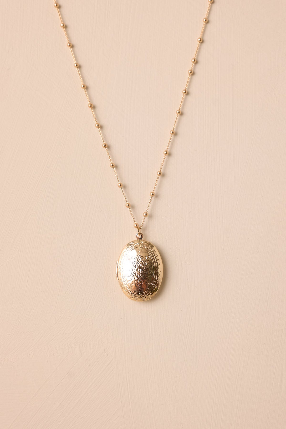 On Repeat Gold Locket Necklace