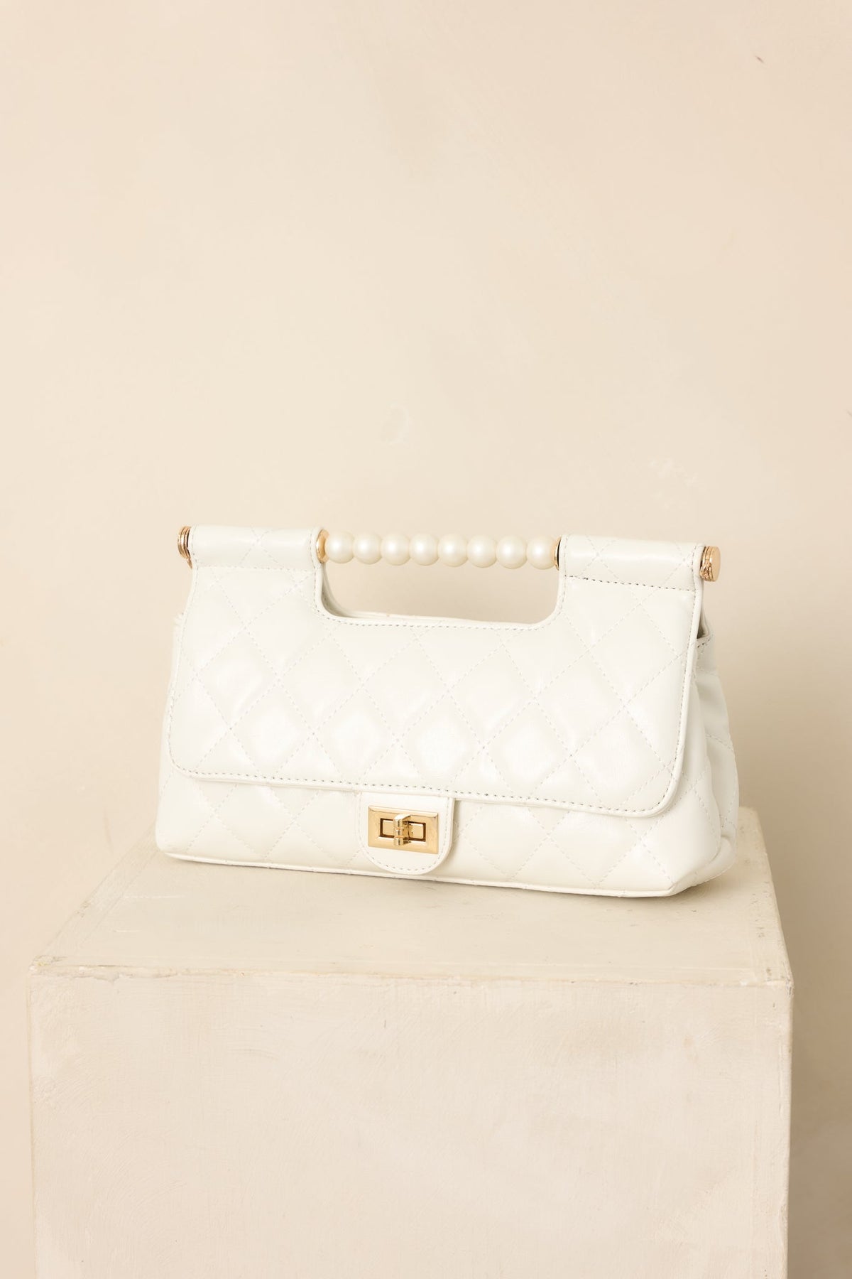 Handled It Beautifully White Quilted Pearl Handle Handbag