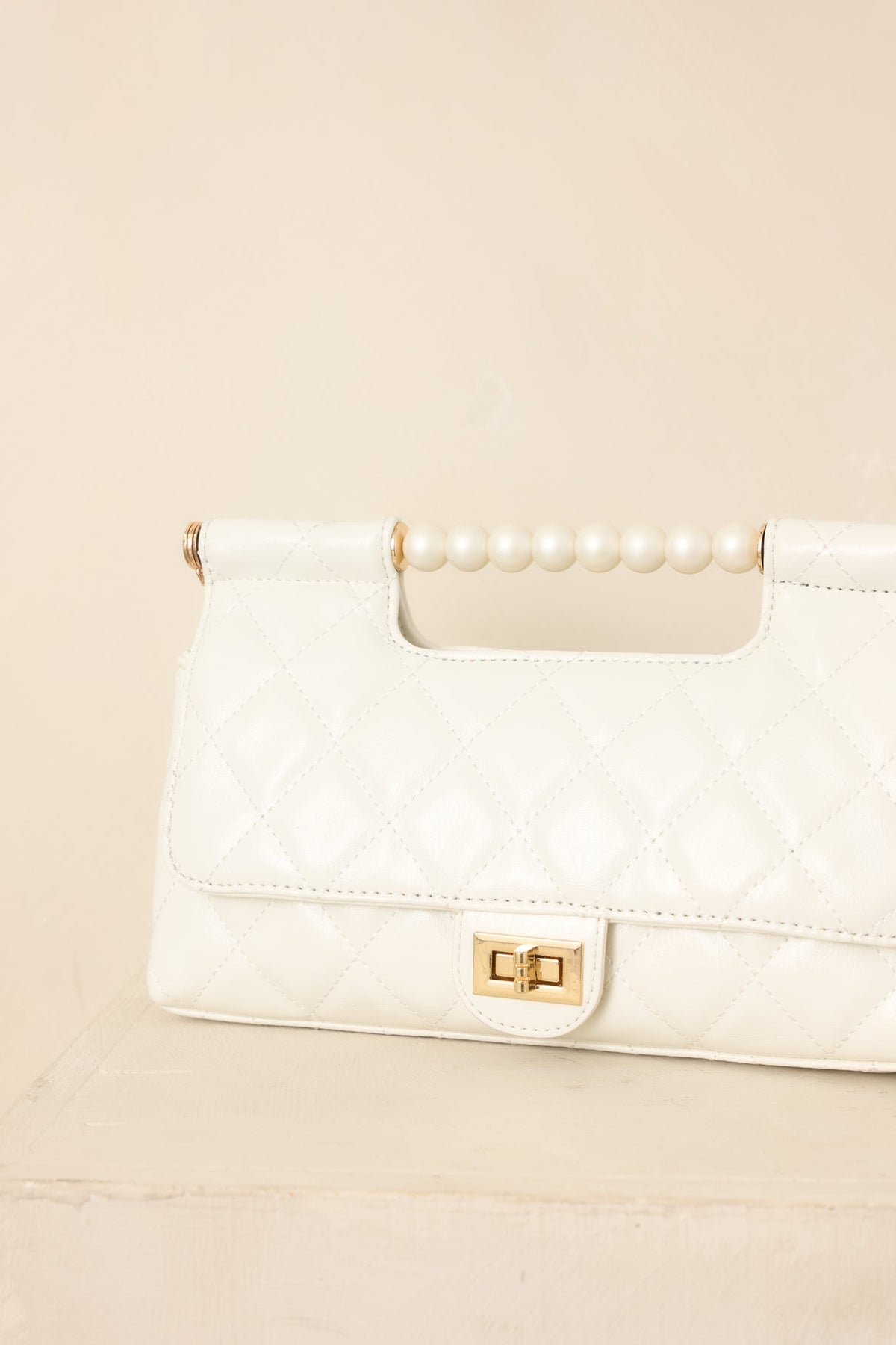 Handled It Beautifully White Quilted Pearl Handle Handbag